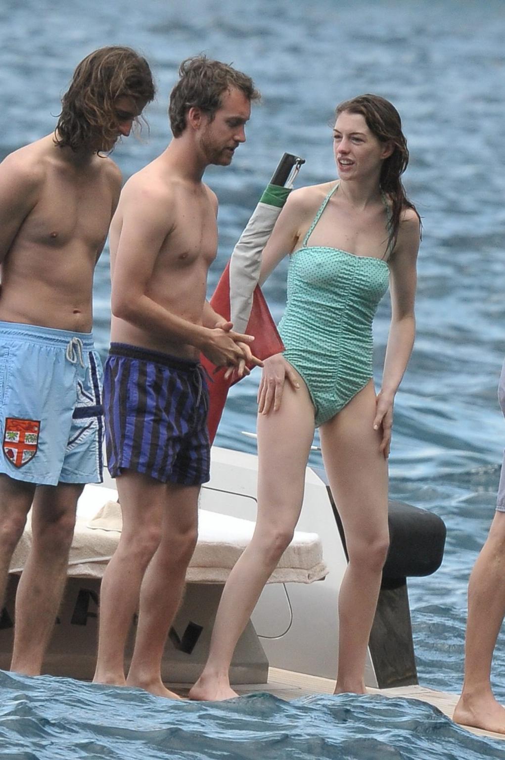 16P Anne Hathaway shows pokies wearing skimpy wet swimsuit in Italy