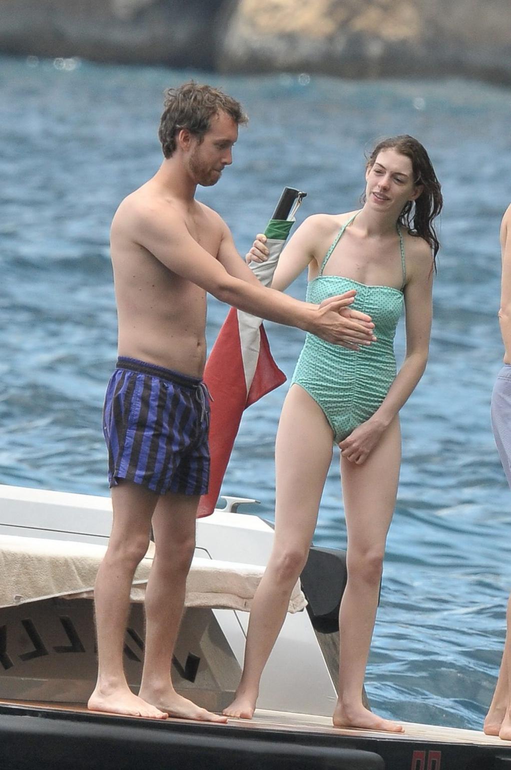 16P Anne Hathaway shows pokies wearing skimpy wet swimsuit in Italy