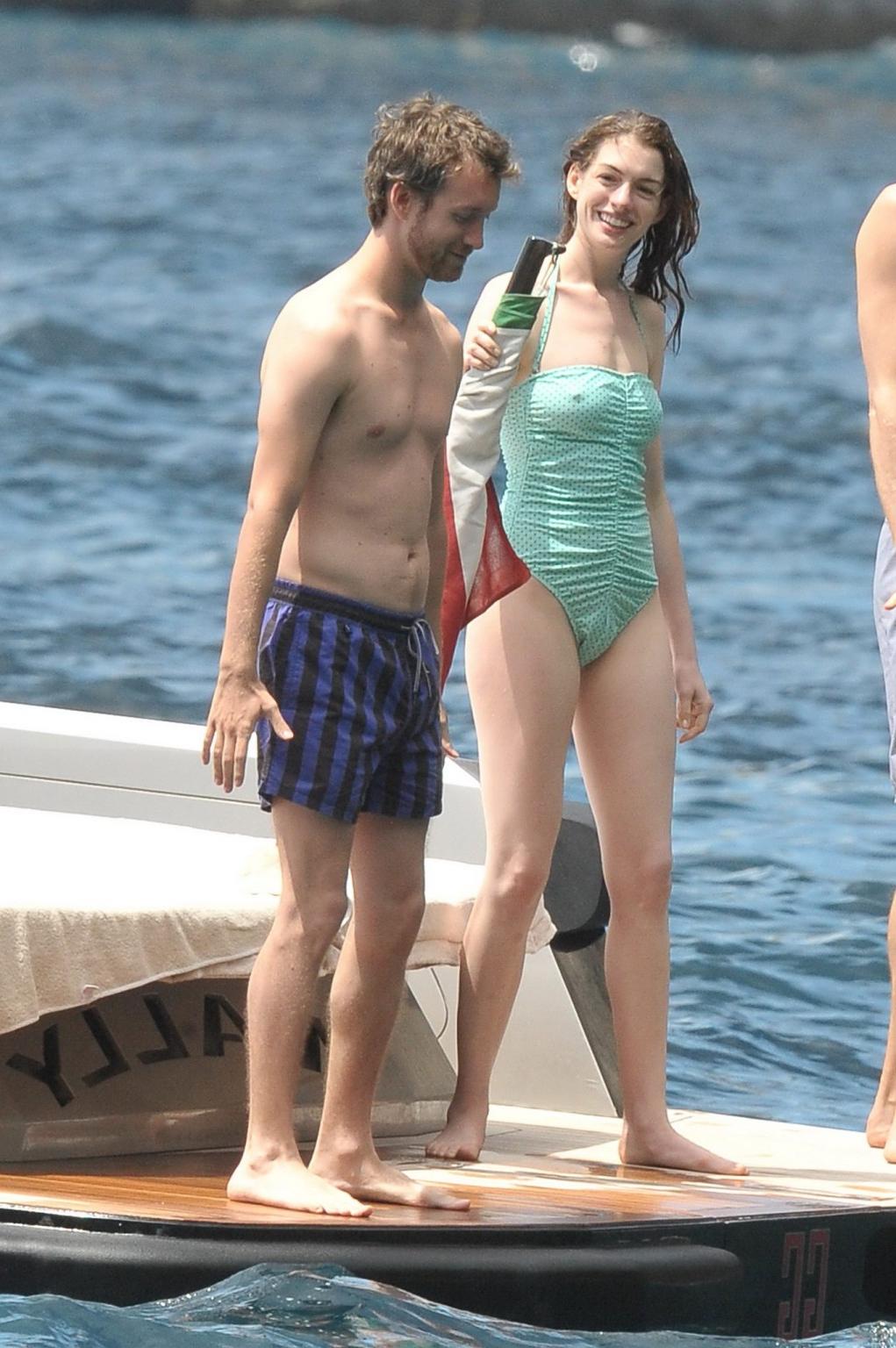 16P Anne Hathaway shows pokies wearing skimpy wet swimsuit in Italy