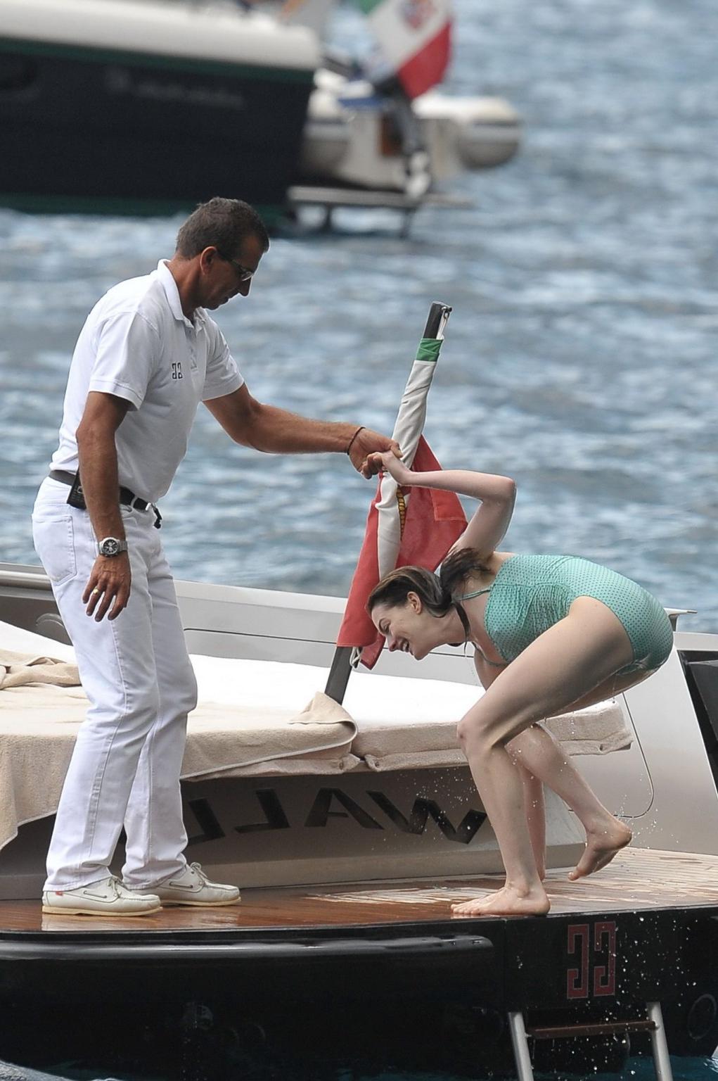 16P Anne Hathaway shows pokies wearing skimpy wet swimsuit in Italy