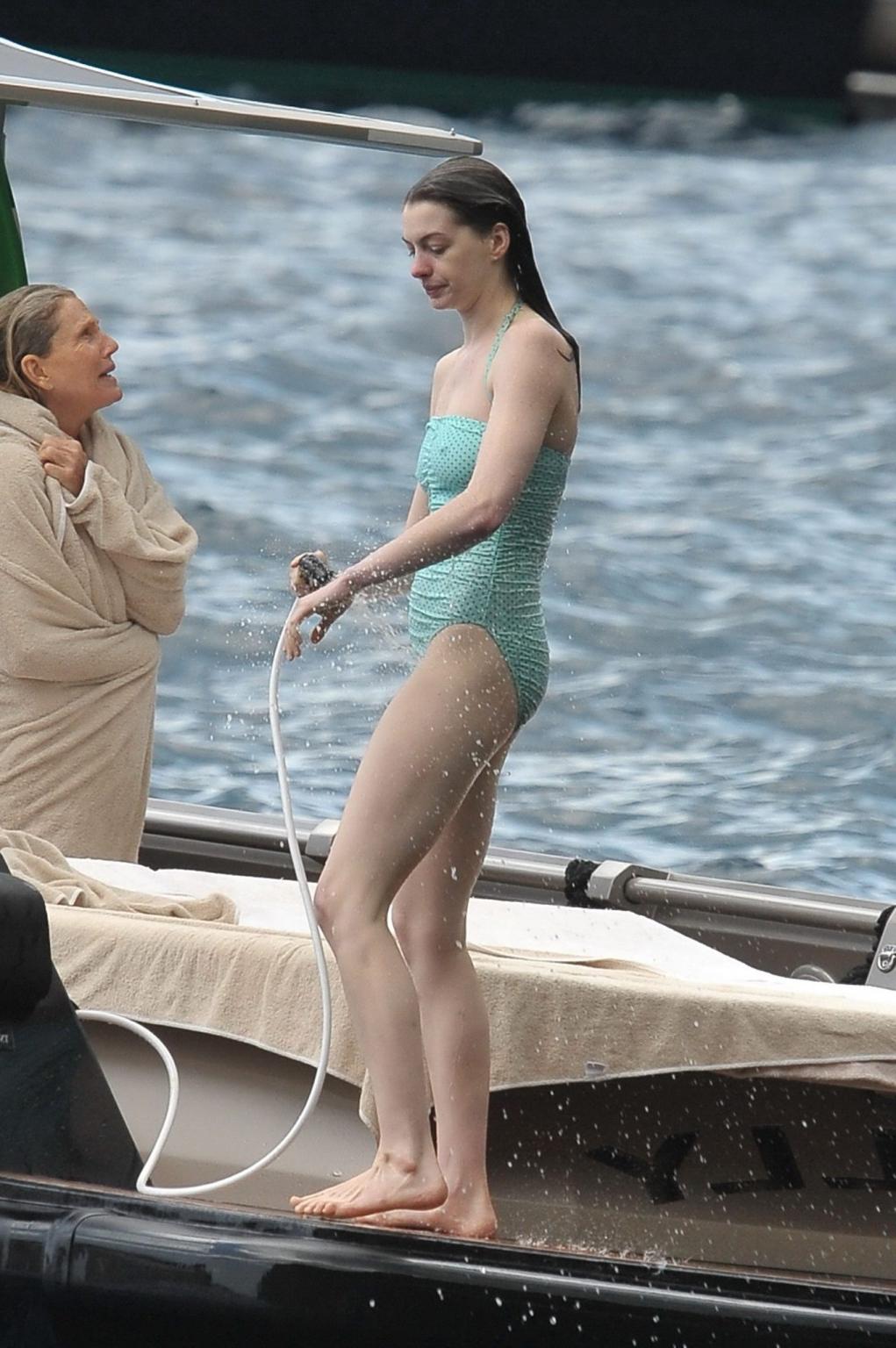 16P Anne Hathaway shows pokies wearing skimpy wet swimsuit in Italy