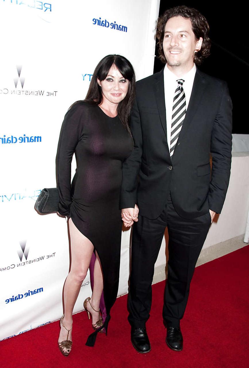 16P Shannen Doherty showing her nice big tits in see thru dress and leggy