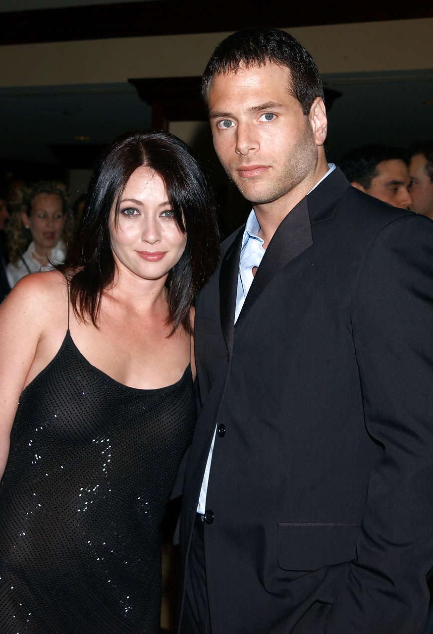 16P Shannen Doherty showing her nice big tits in see thru dress and leggy