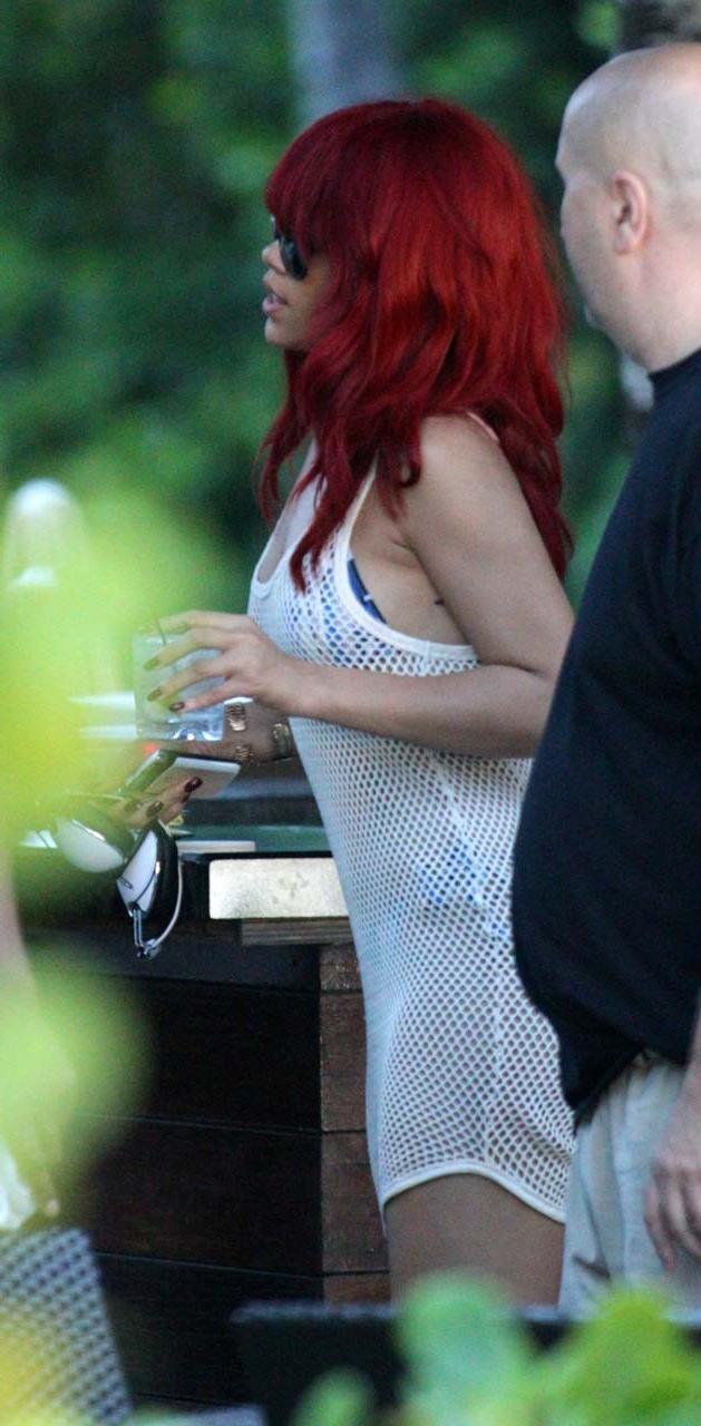 16P Rihanna exposing her fucking sexy ass and nice tits in see thru dress