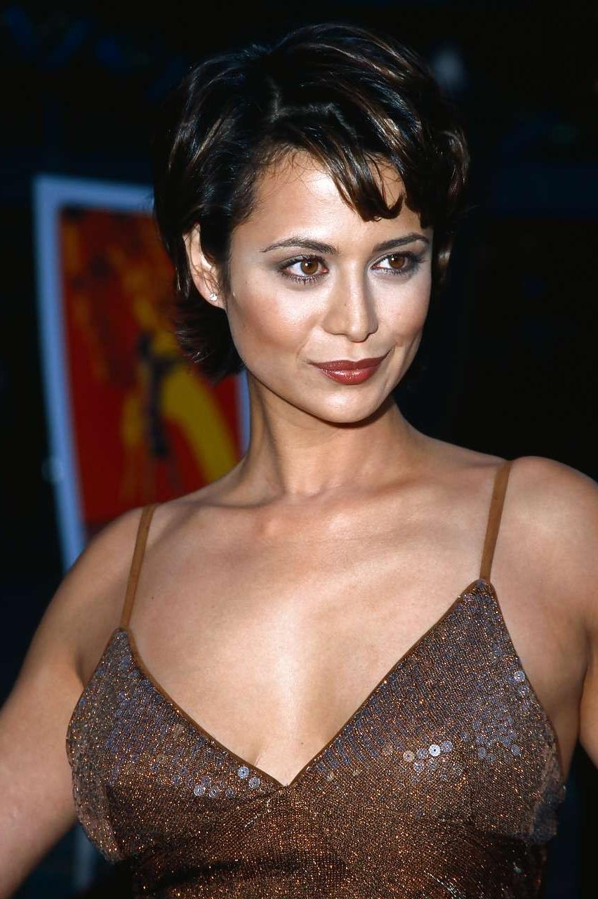 16P Catherine Bell very leggy in mini skirt and showing big cleavage