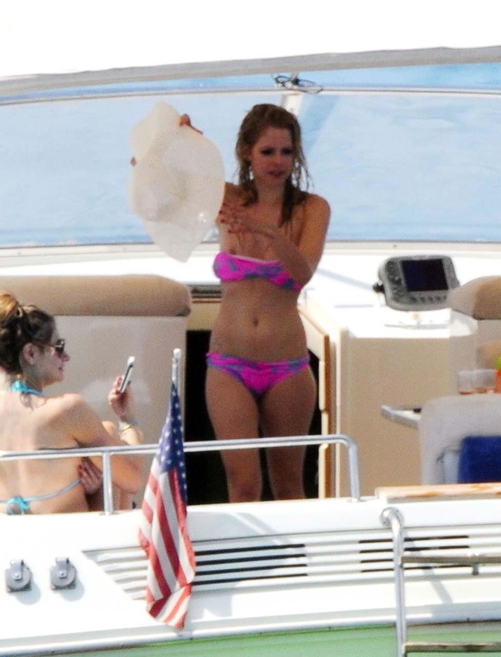 16P Avril Lavigne exposing sexy body and hot ass in bikini on yacht