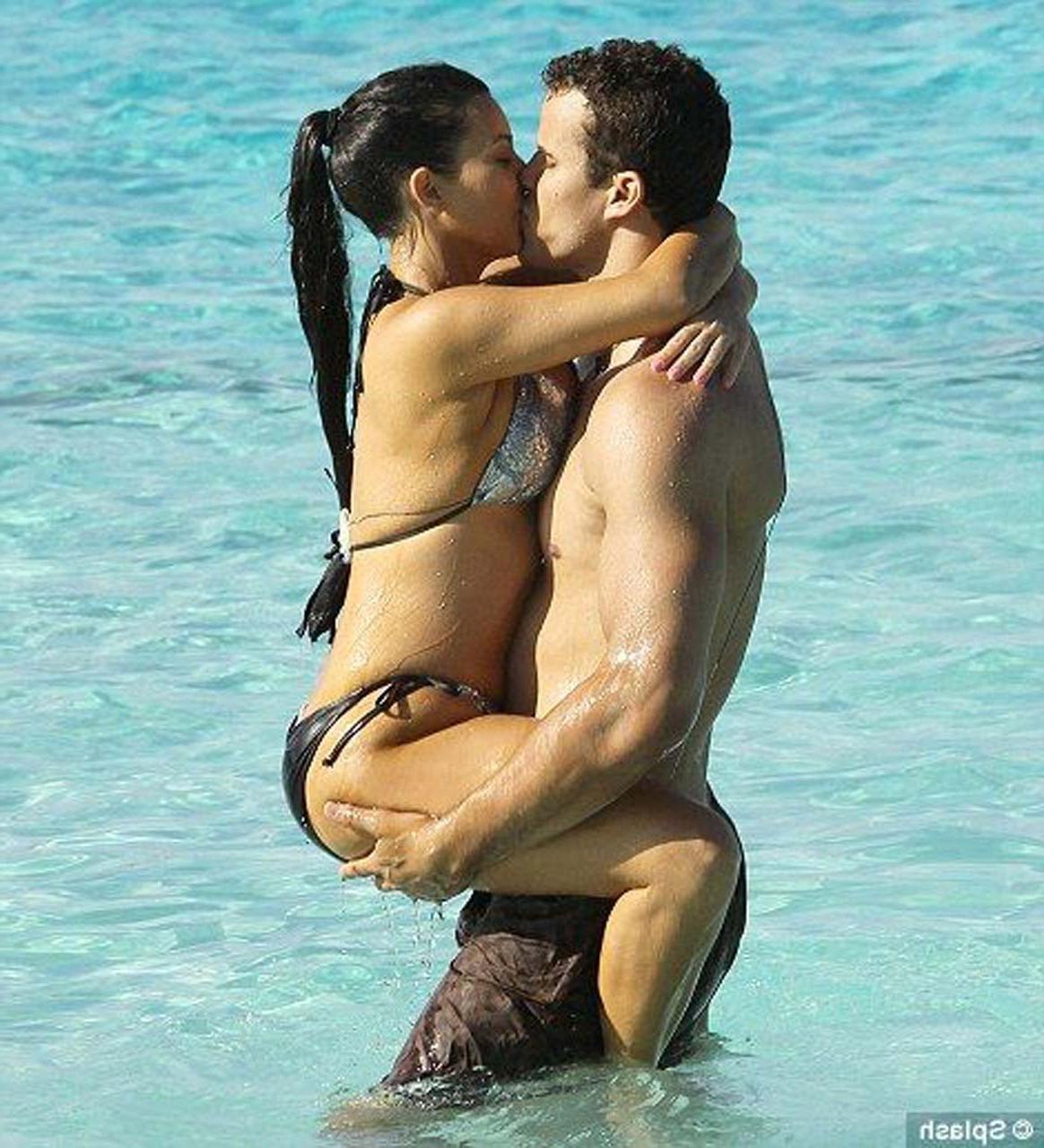 16P Kim Kardashian exposing sexy body and huge boobs in bikini on beach