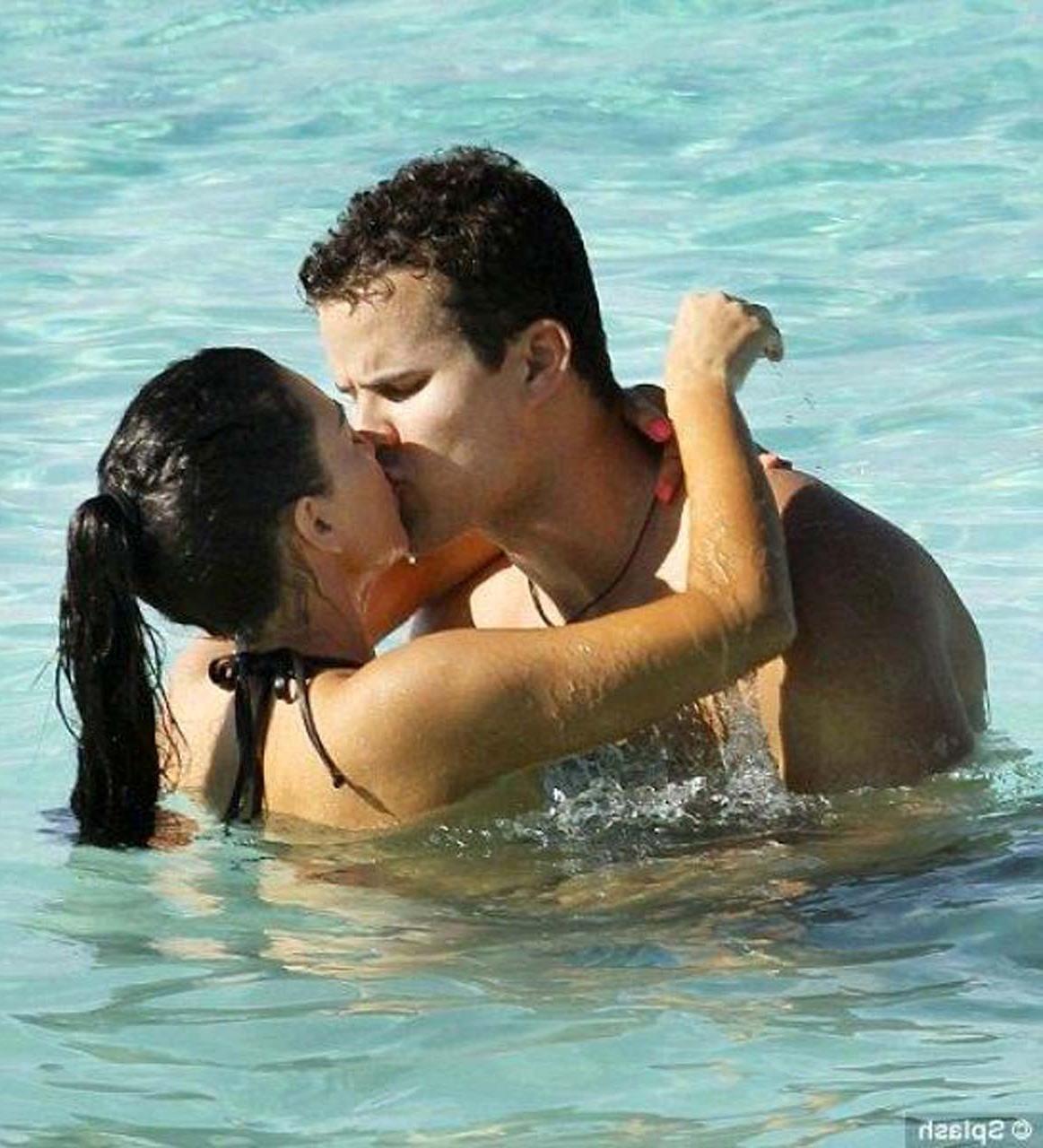 16P Kim Kardashian exposing sexy body and huge boobs in bikini on beach