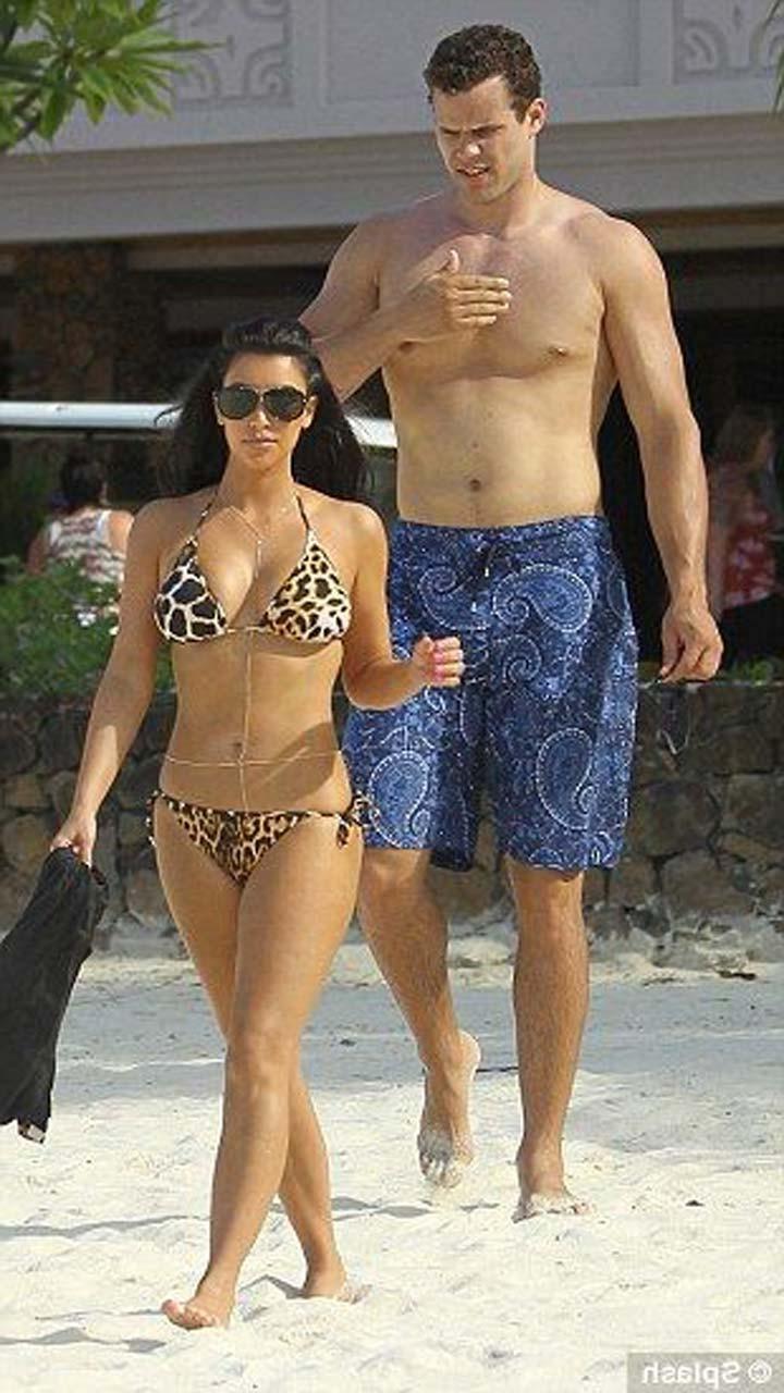 16P Kim Kardashian exposing sexy body and huge boobs in bikini on beach