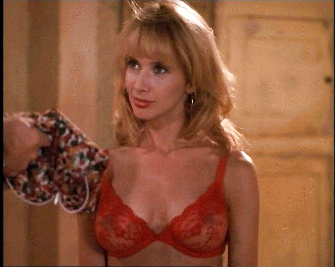 16P Rosanna Arquette showing her nice tits and great ass in thong
