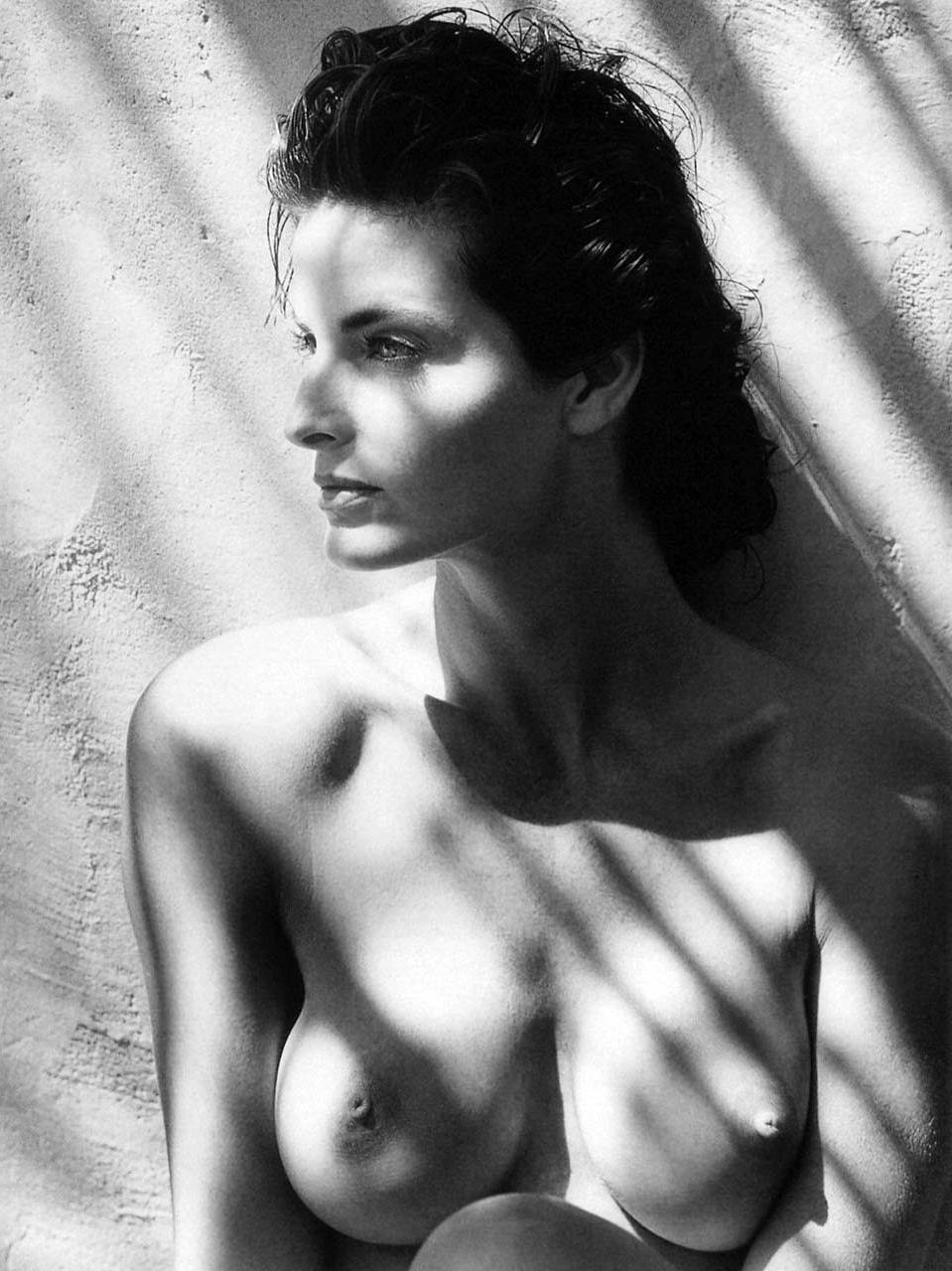 16P Joan Severance exposing her hairy pussy and huge boobs and posing in stockings