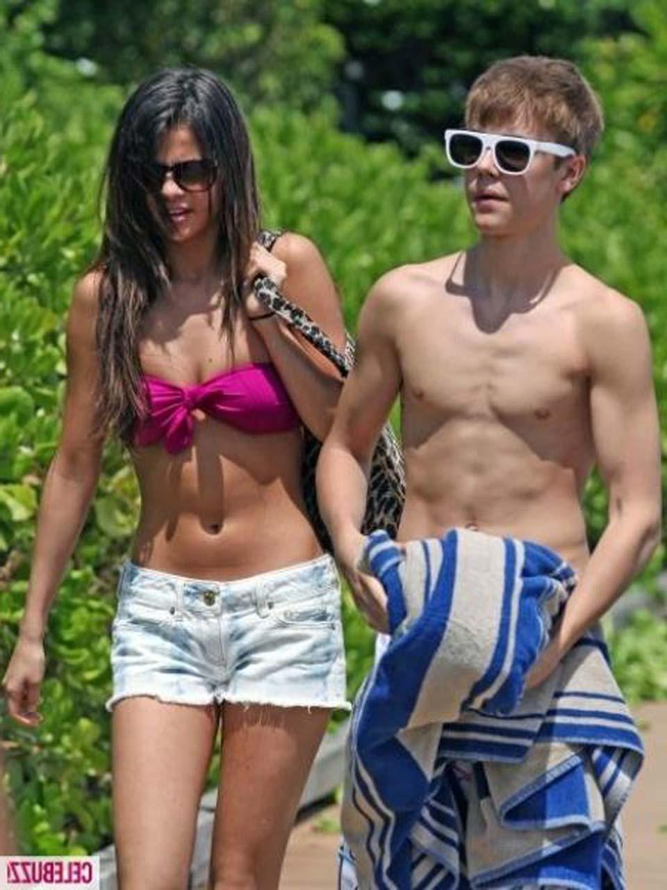 16P Selena Gomez exposing sexy body in bikini while walking with her boyfriend