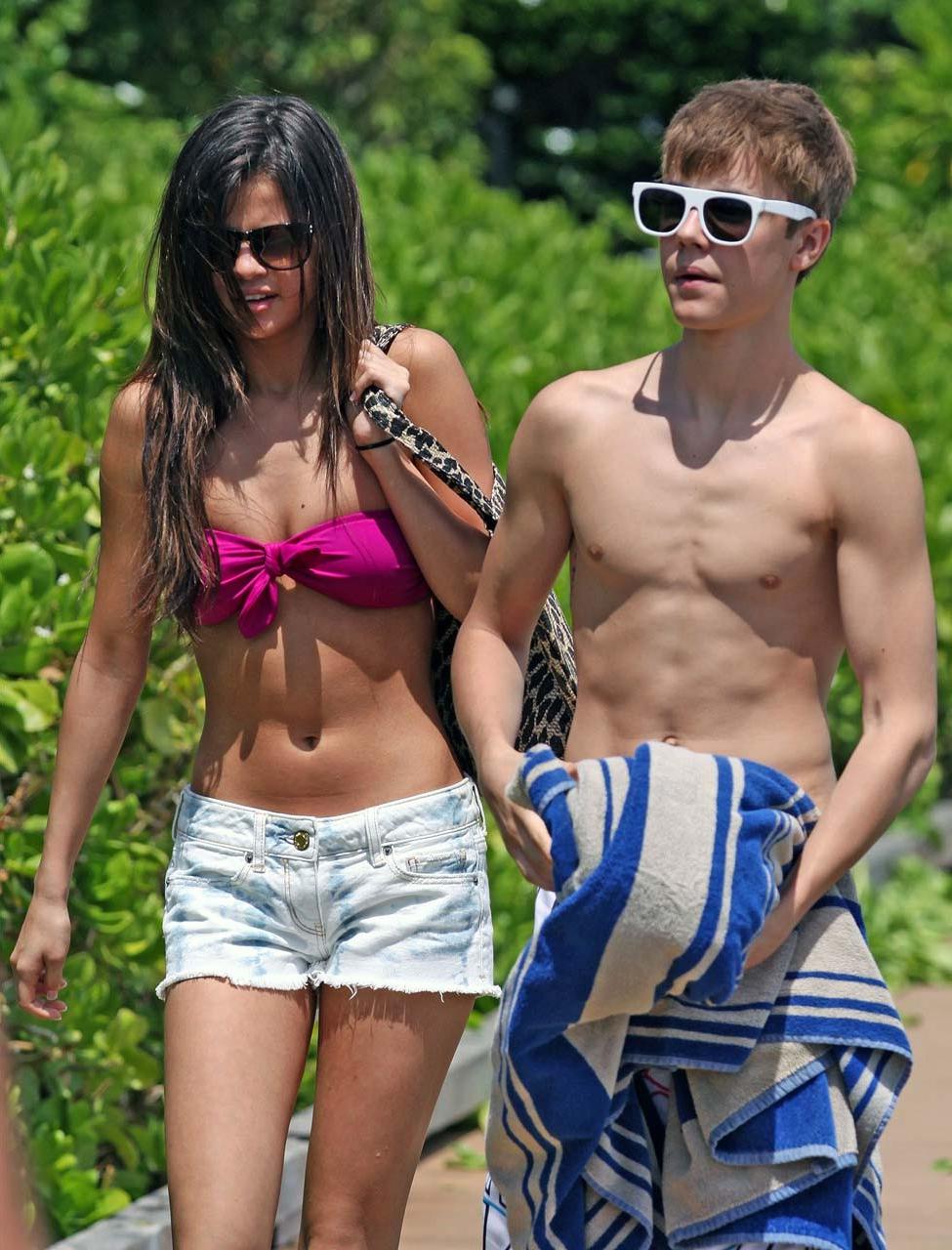 16P Selena Gomez exposing sexy body in bikini while walking with her boyfriend