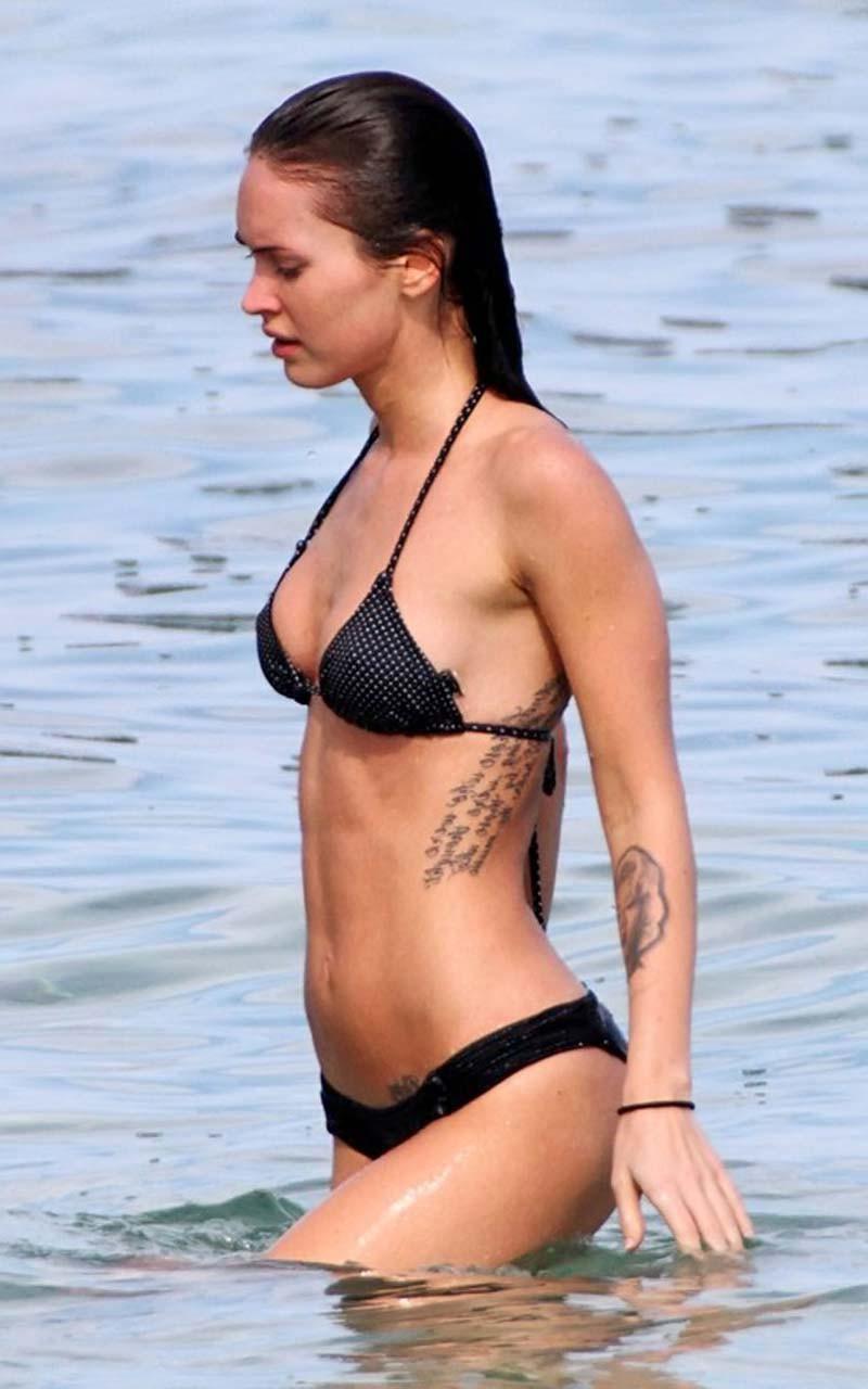 16P Megan Fox posing topless as angel and showing sexy body in bikini on beach