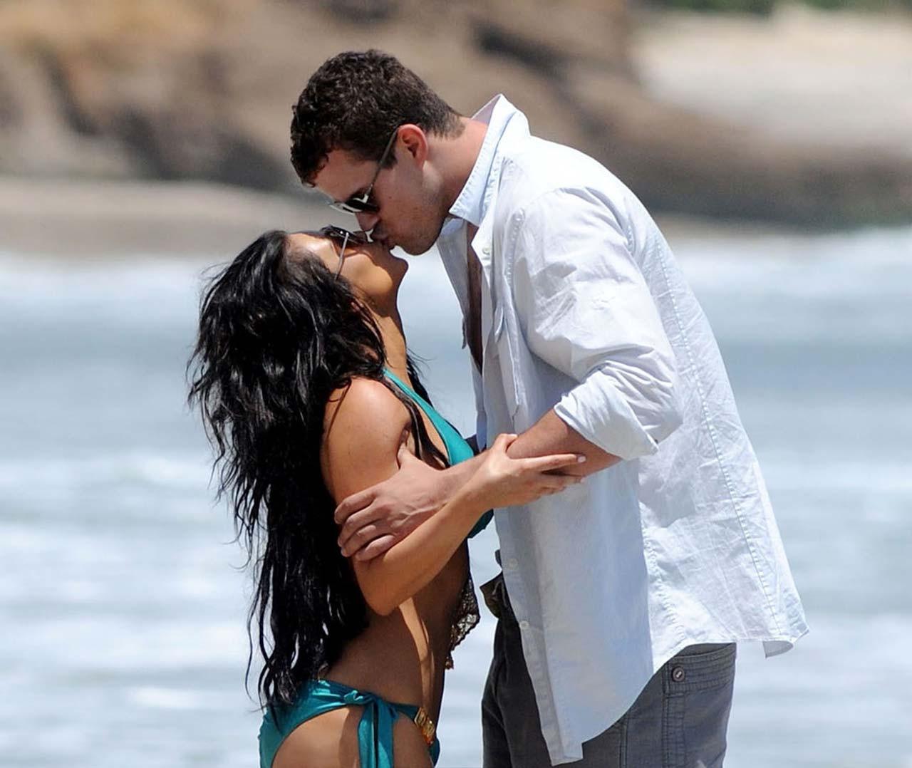 16P Kim Kardashian exposing sexy body and huge boobs in bikini on beach