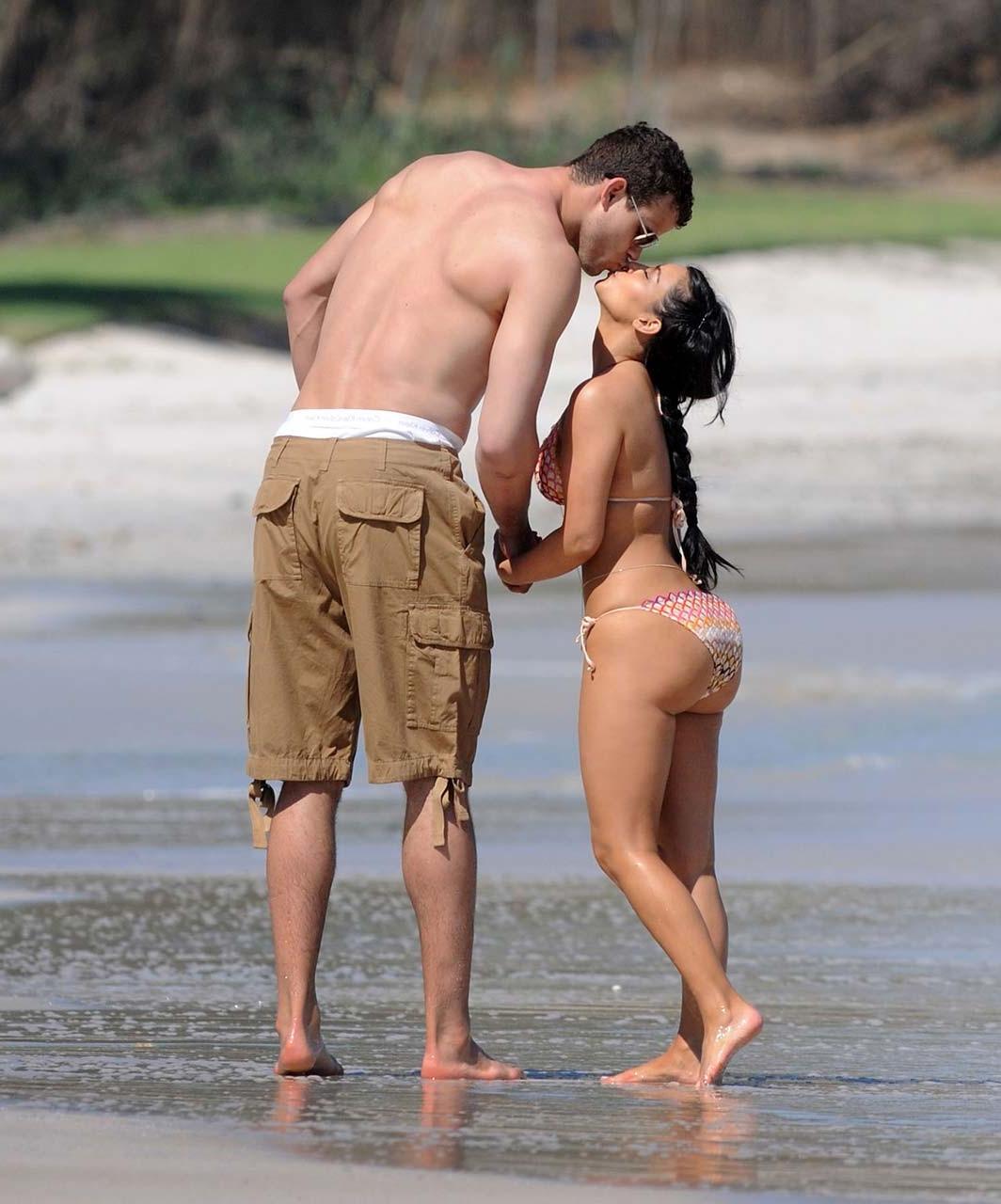16P Kim Kardashian exposing sexy body and huge boobs in bikini on beach