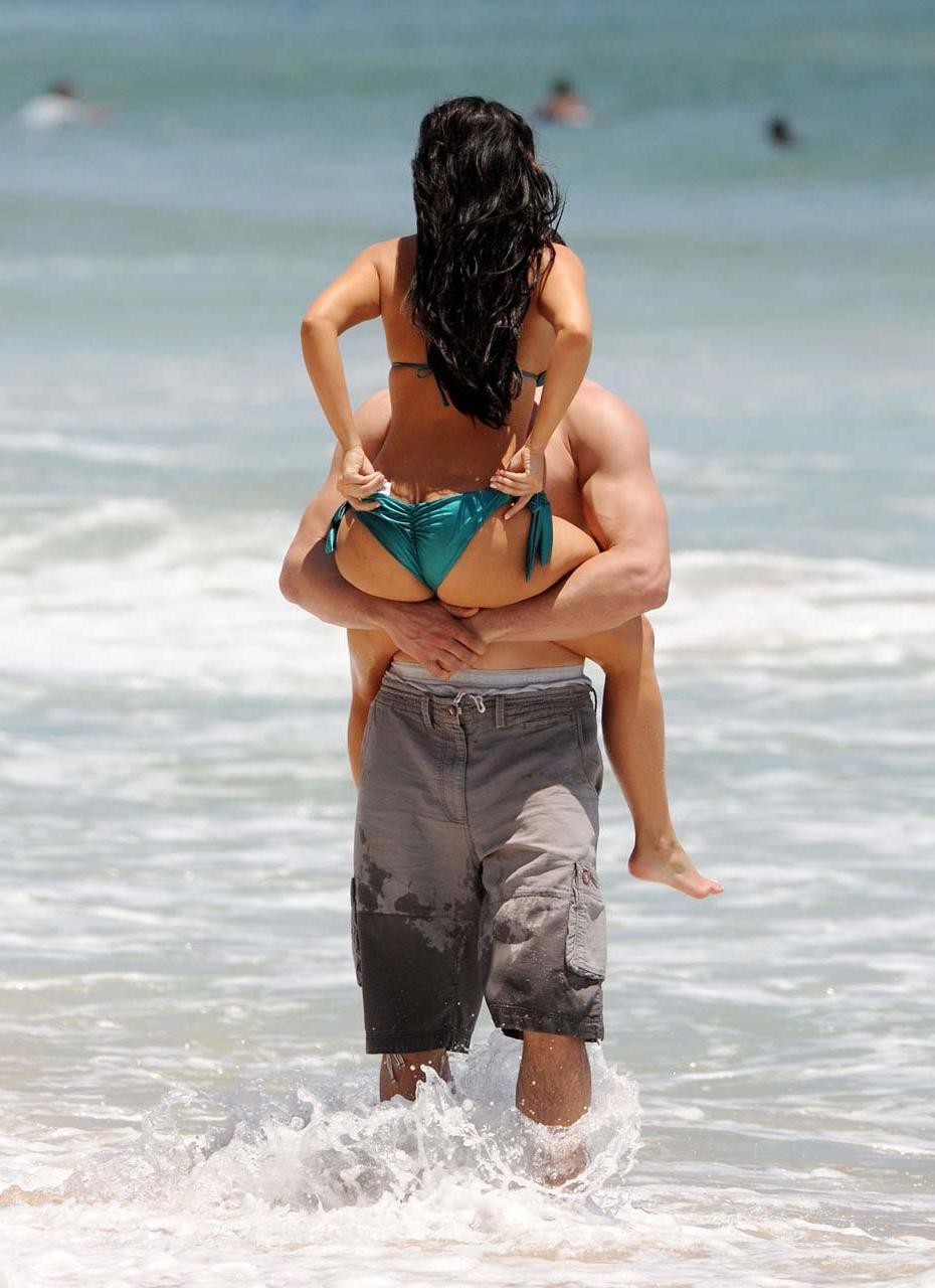 16P Kim Kardashian exposing sexy body and huge boobs in bikini on beach