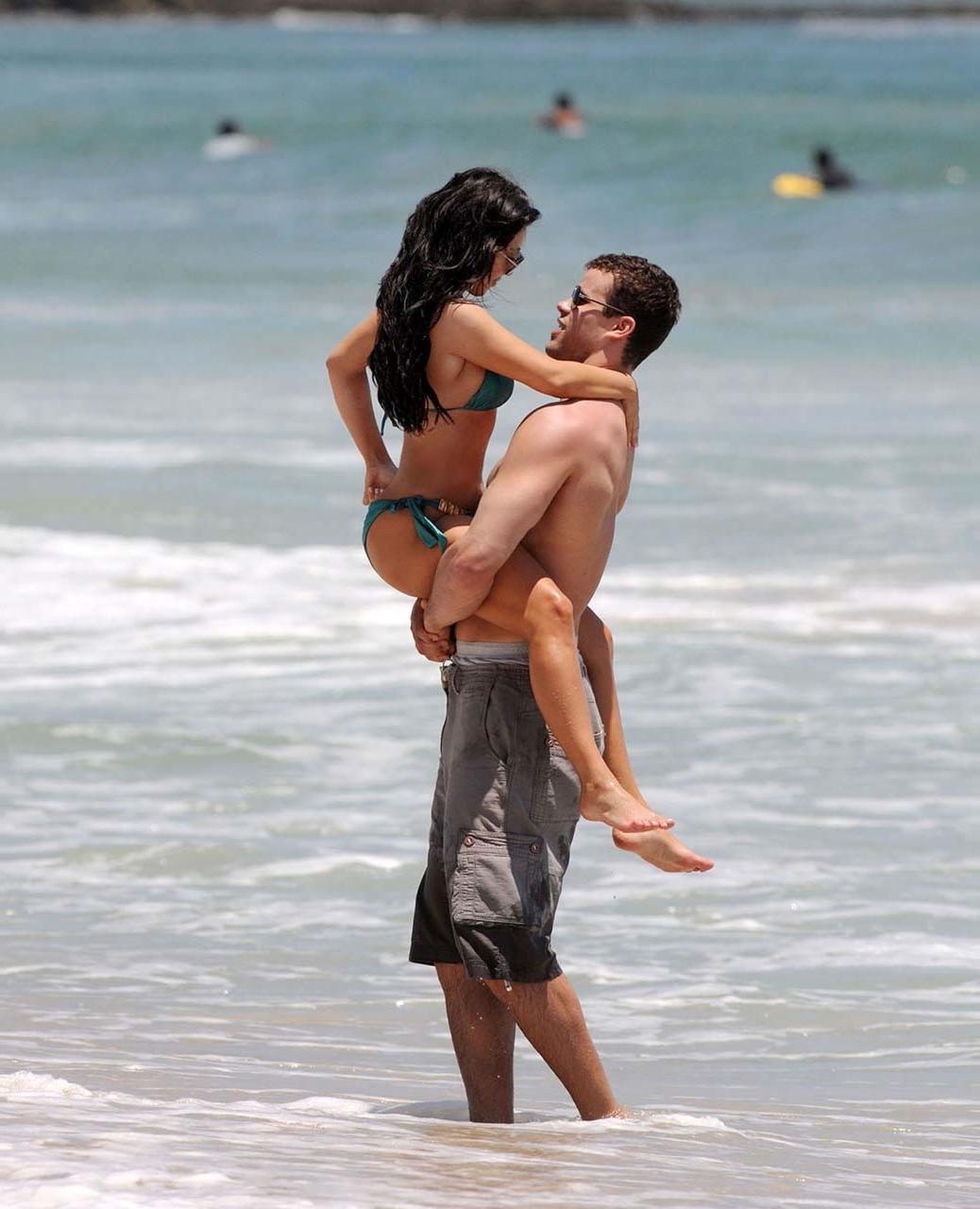 16P Kim Kardashian exposing sexy body and huge boobs in bikini on beach