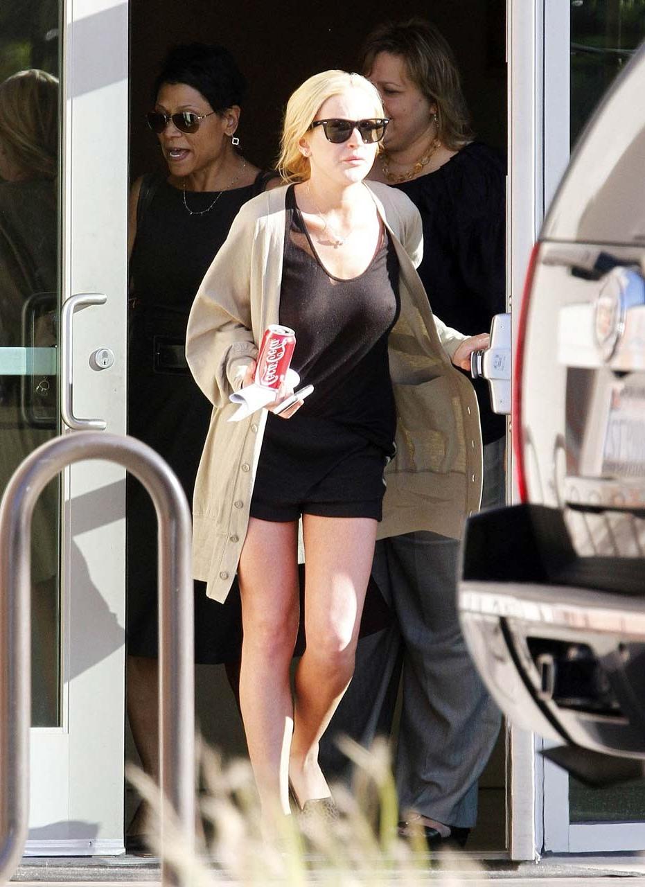 16P Lindsay Lohan showing her nice big boobs in see thru top paparazzi pictures