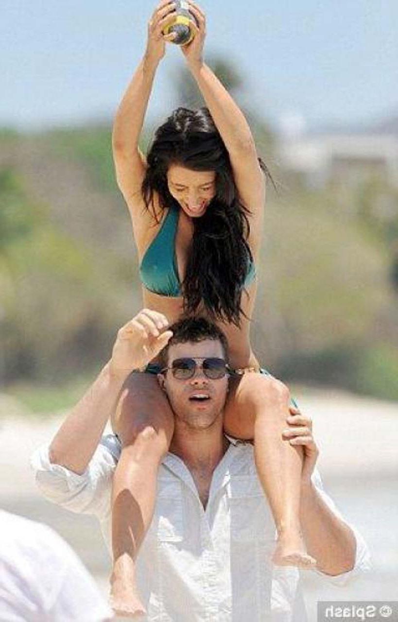 16P Kim Kardashian exposing sexy body and hot ass in bikini on beach