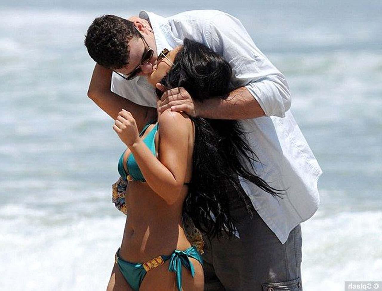 16P Kim Kardashian exposing sexy body and hot ass in bikini on beach