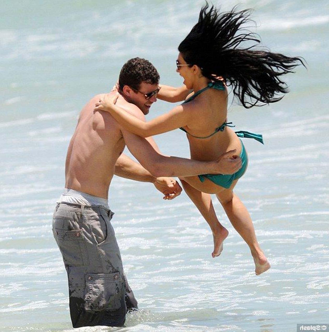 16P Kim Kardashian exposing sexy body and hot ass in bikini on beach