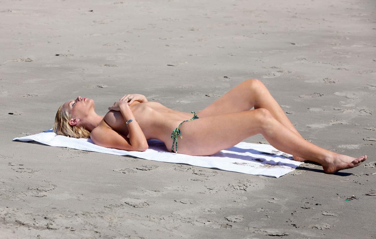 16P Sophie Monk exposing her nice big boobs and looking sexy in bikini on beach papa
