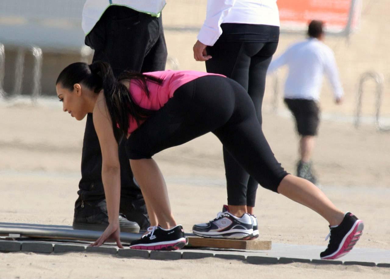 16P Kim Kardashian exposing her sexy body and huge boobs while exerciseing