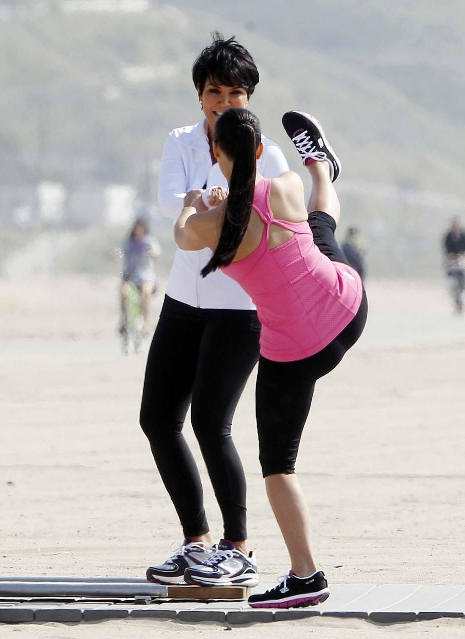 16P Kim Kardashian exposing her sexy body and huge boobs while exerciseing