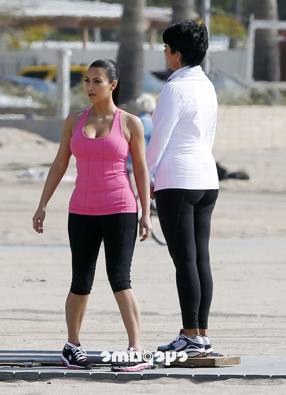 16P Kim Kardashian exposing her sexy body and huge boobs while exerciseing
