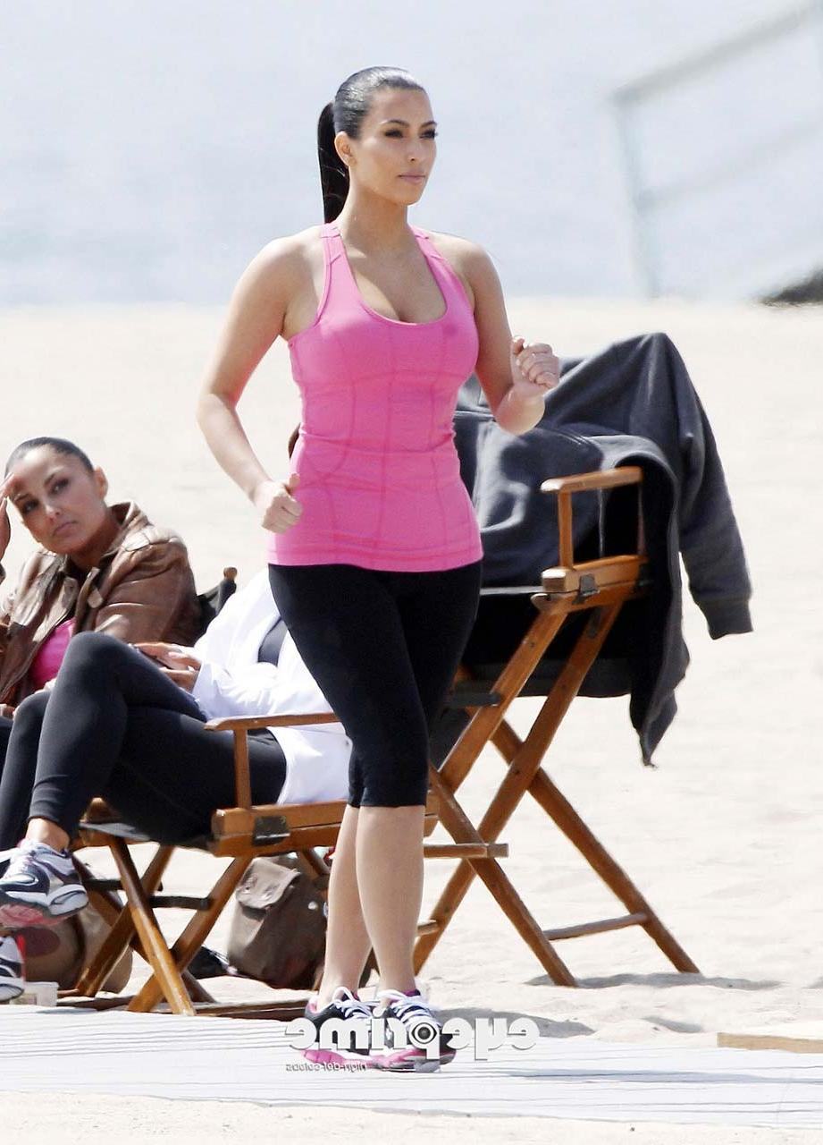 16P Kim Kardashian exposing her sexy body and huge boobs while exerciseing