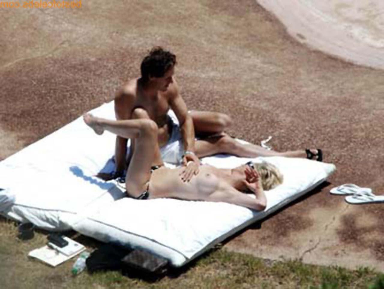 16P Sharon Stone enjoying in topless on beach and exposing sexy ass in bikini