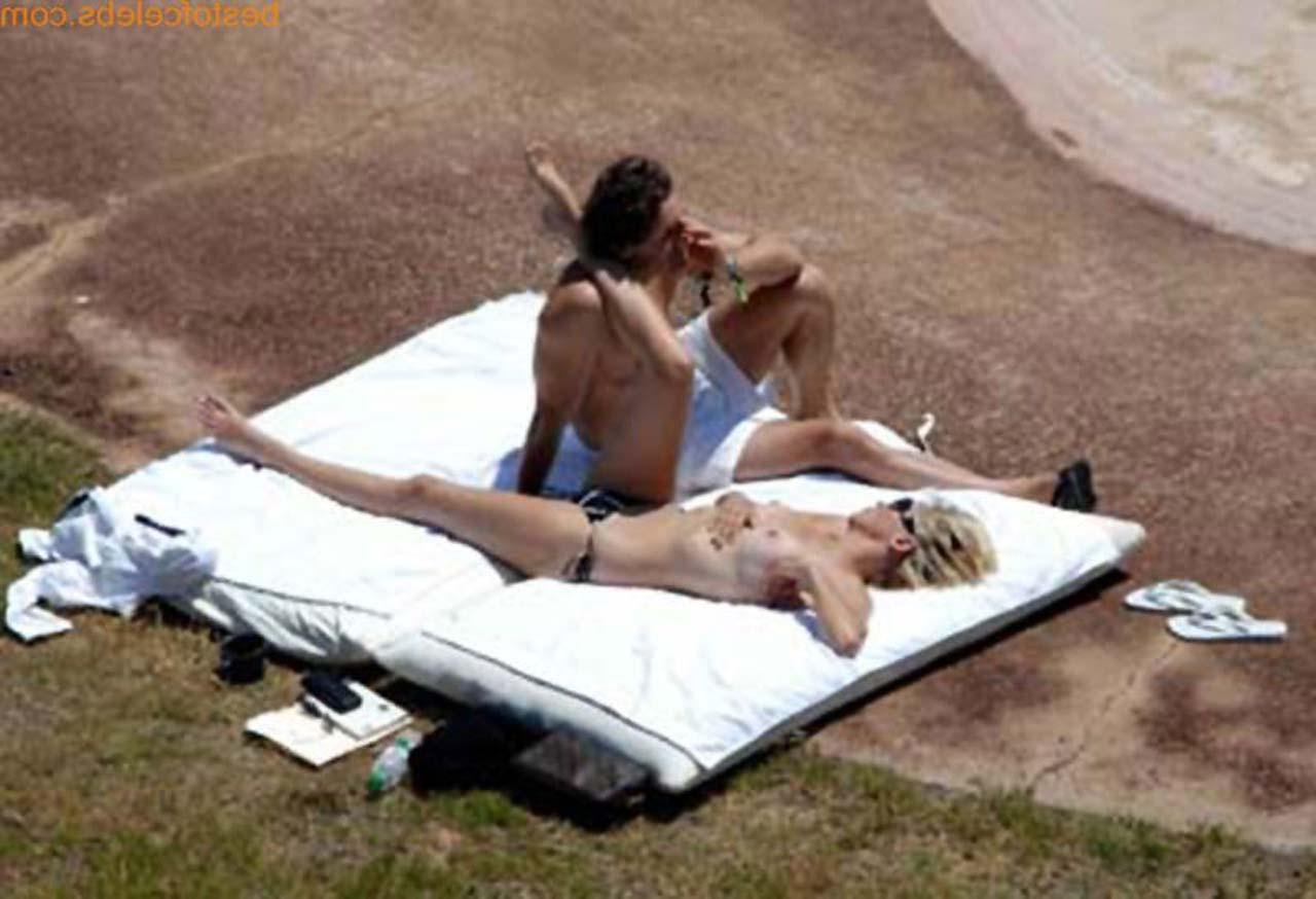16P Sharon Stone enjoying in topless on beach and exposing sexy ass in bikini