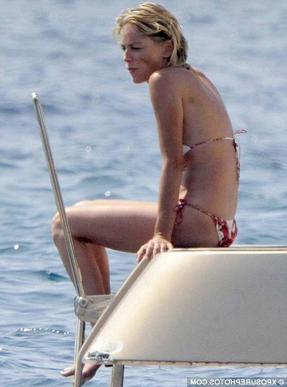 16P Sharon Stone enjoying in topless on beach and exposing sexy ass in bikini