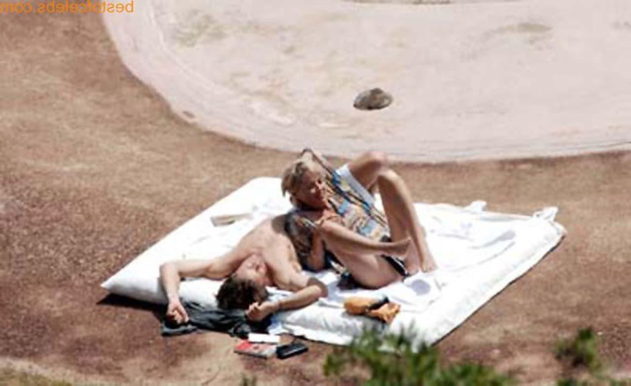 16P Sharon Stone enjoying in topless on beach and exposing sexy ass in bikini