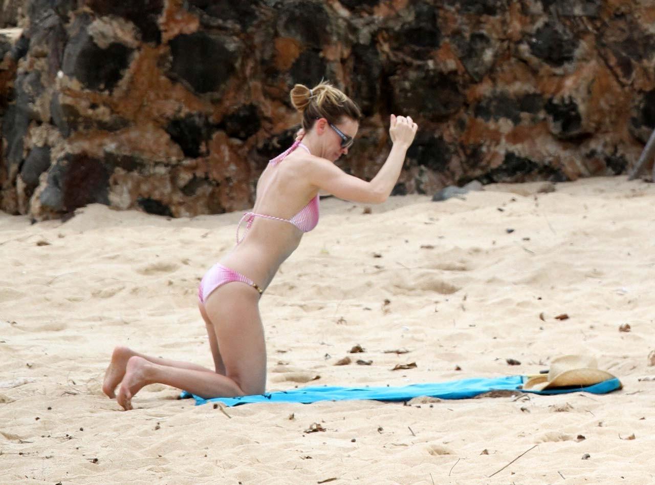 16P Hilary Swank exposing sexy body and hot ass in bikini on beach