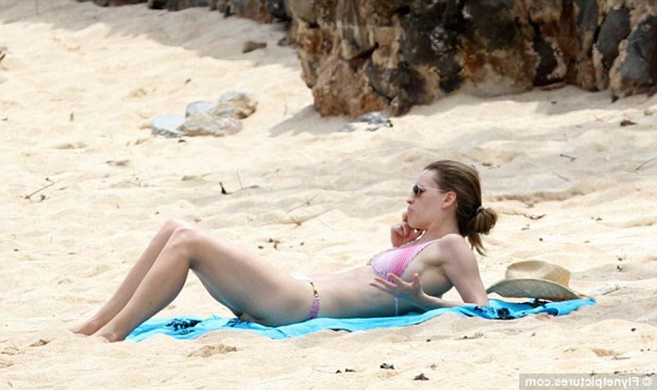 16P Hilary Swank exposing sexy body and hot ass in bikini on beach