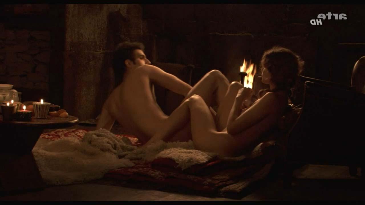 16P Laetitia Casta exposing her nice big boobs and hairy pussy in nude movie scenes