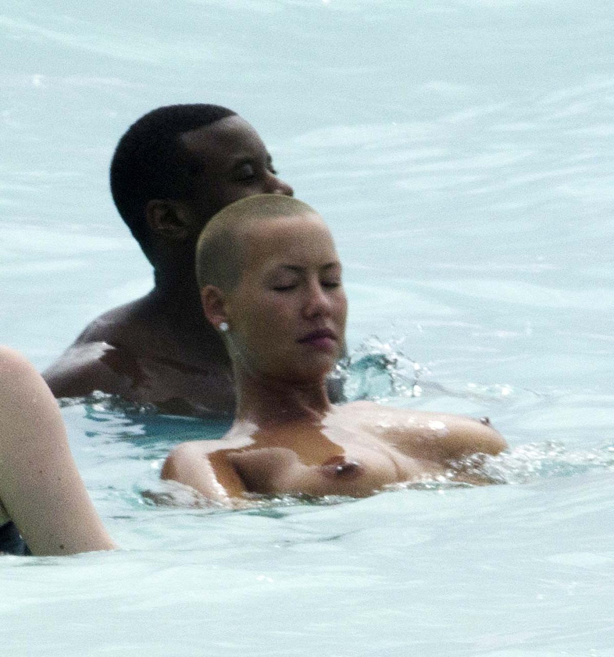 16P Amber Rose exposing her huge boobs and looking sexy in bikini on beach paparazzi
