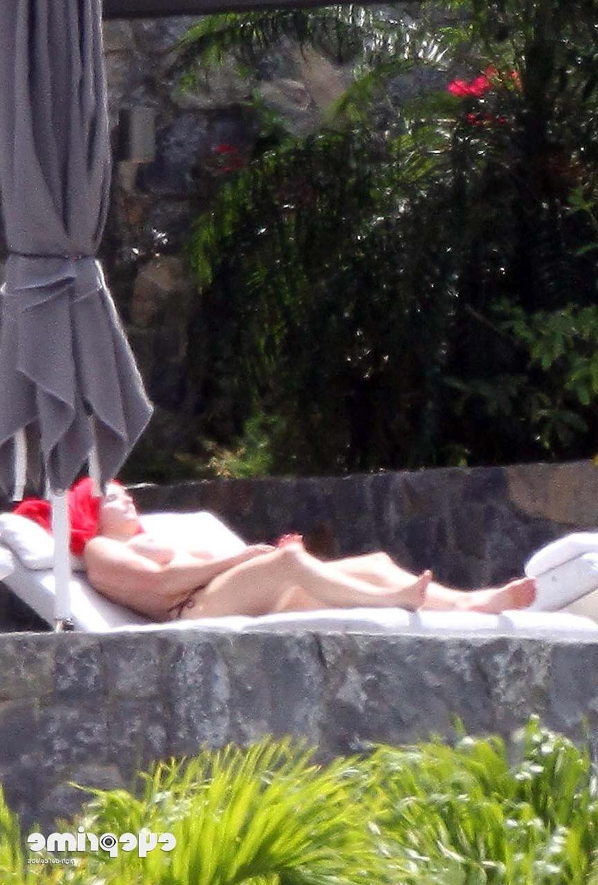 16P Stephanie Seymour exposing her nice big boobs while sunbathing and in yellow see