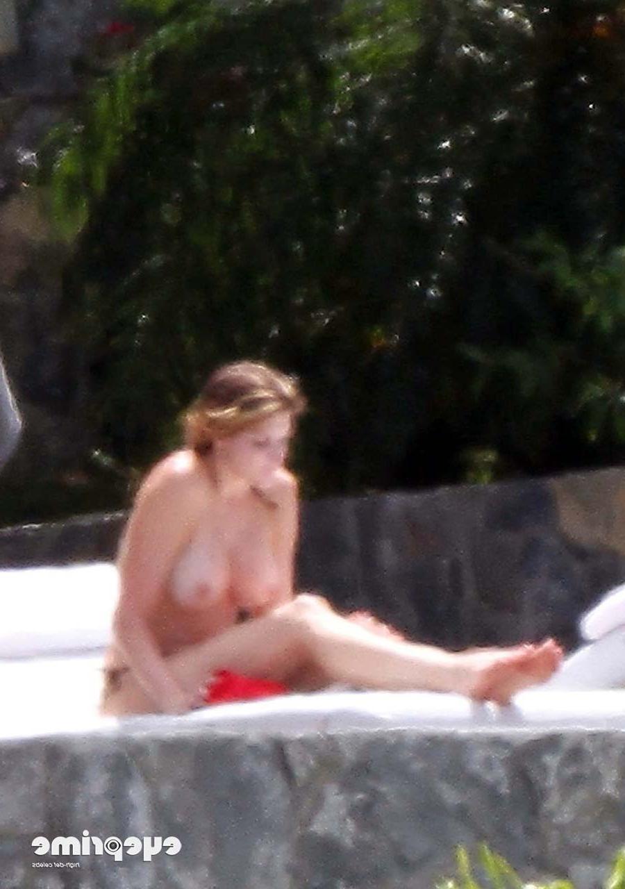 16P Stephanie Seymour exposing her nice big boobs while sunbathing and in yellow see