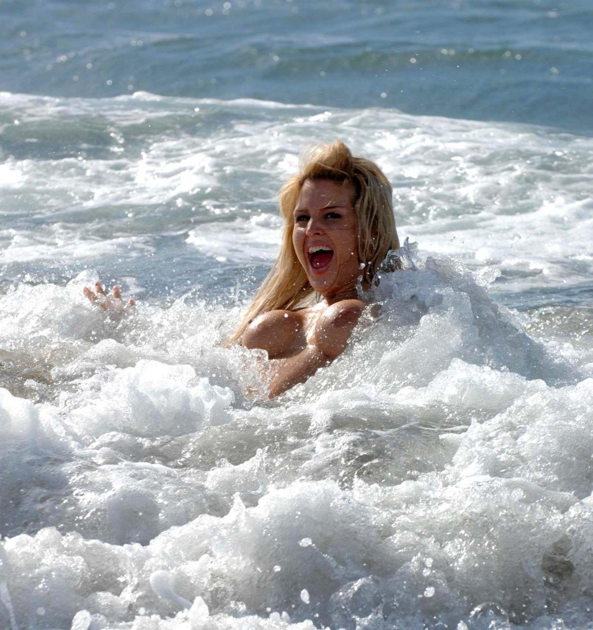 10P Michelle Bass exposing her nice big boobs on beach paparazzi pictures