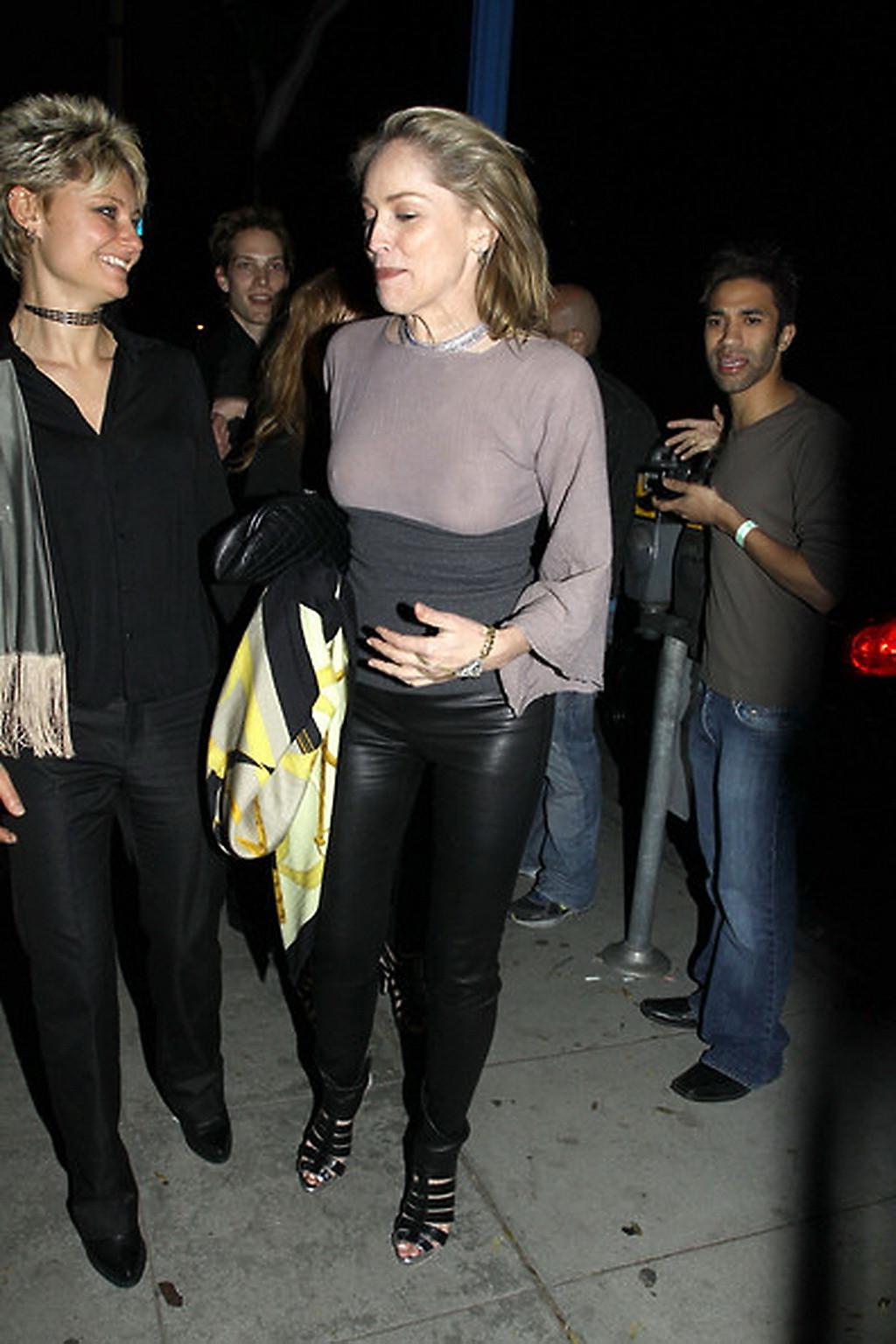 16P Sharon Stone shows off her boobs wearing see through top out in Brentwood