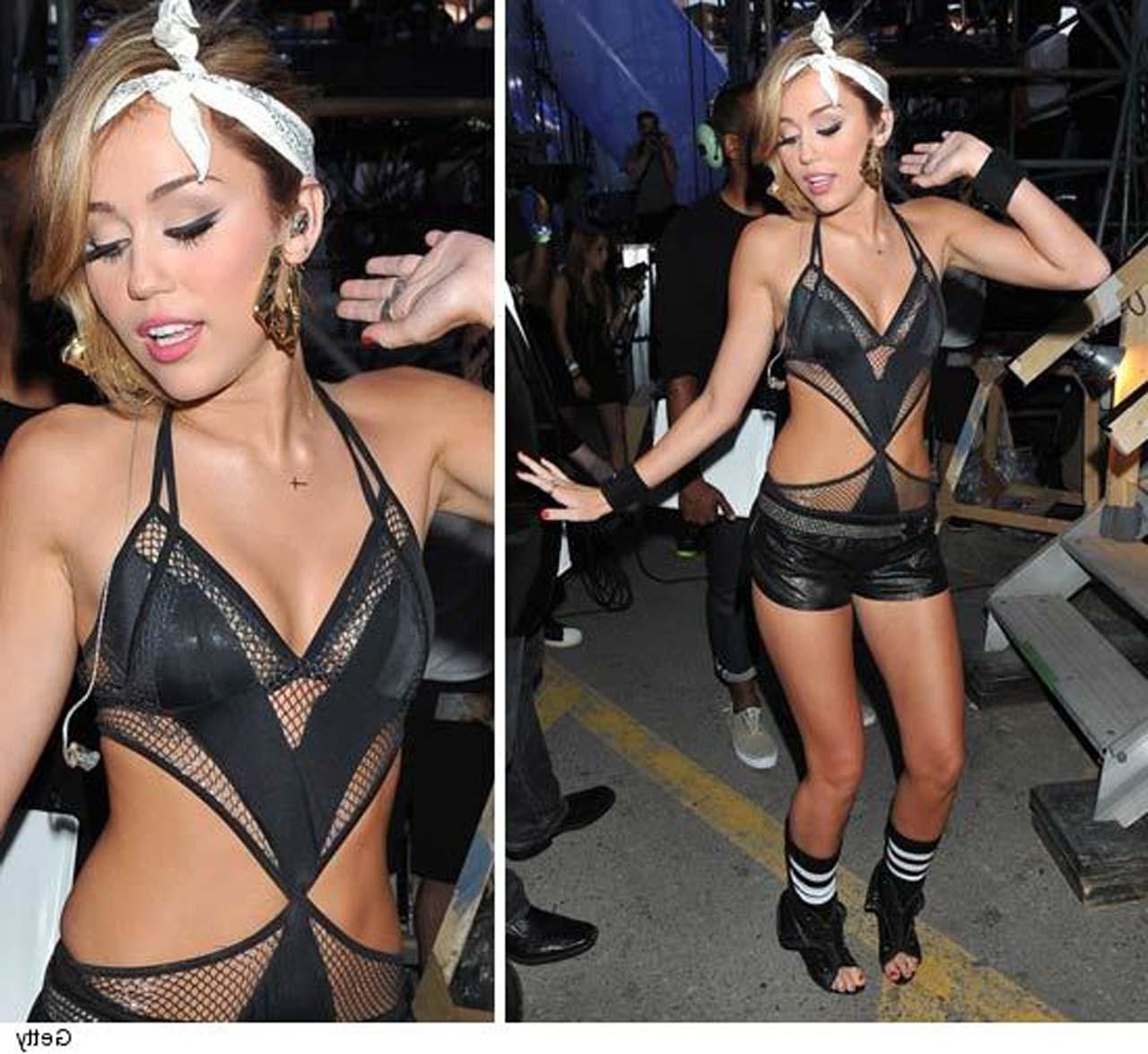 10P Miley Cyrus posing sexy in slutty outfit and showing her great legs in mini dres