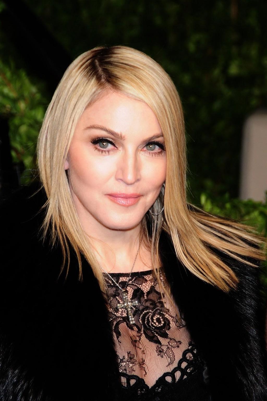 16P Madonna wearing black lace  fishnets at the Vanity Fair Oscar Party