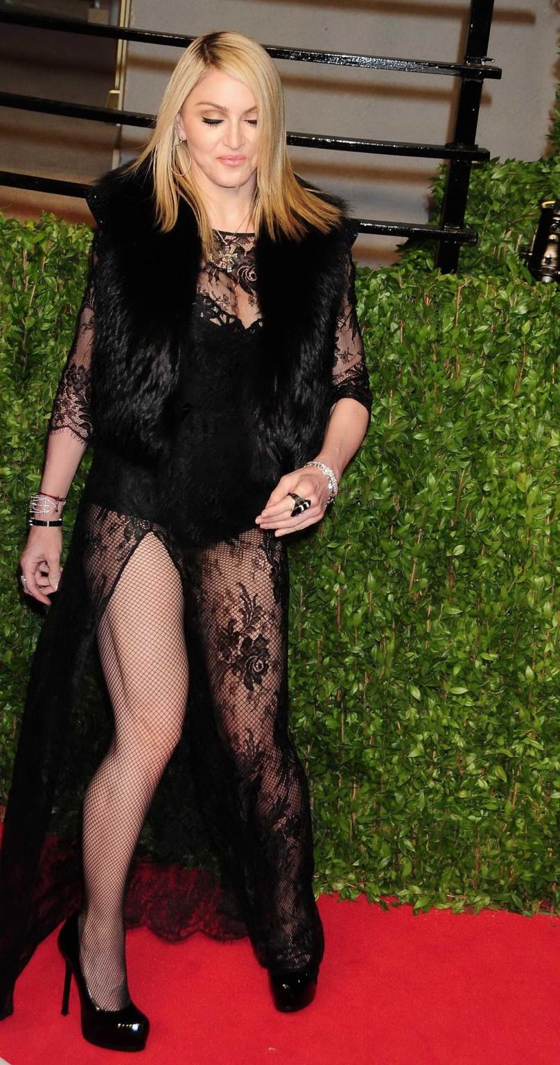 16P Madonna wearing black lace  fishnets at the Vanity Fair Oscar Party