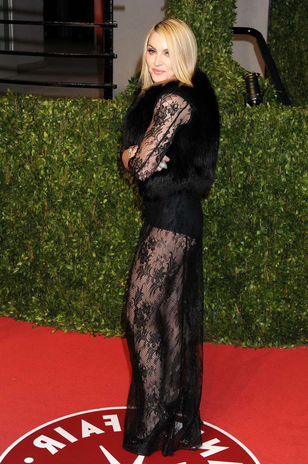16P Madonna wearing black lace  fishnets at the Vanity Fair Oscar Party