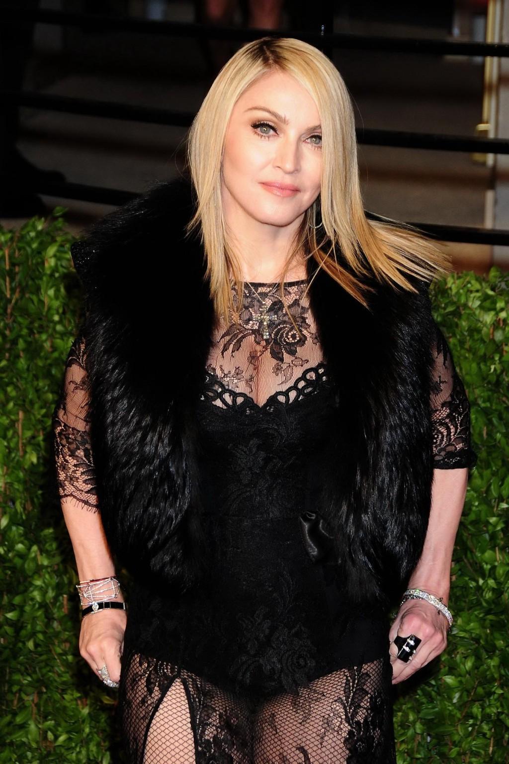 16P Madonna wearing black lace  fishnets at the Vanity Fair Oscar Party