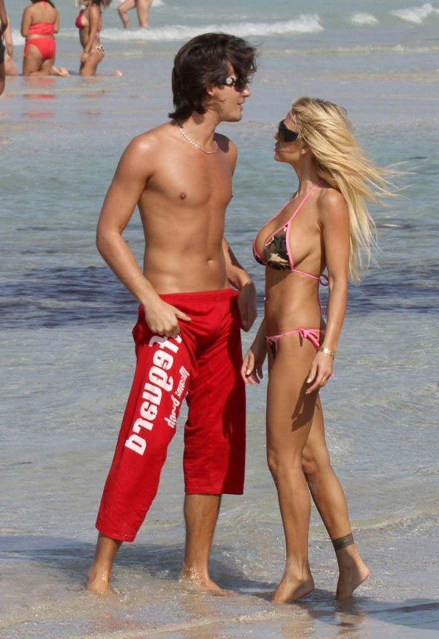 10P Shauna Sand showing her great ass in thong bikini on beach paparazzi pictures