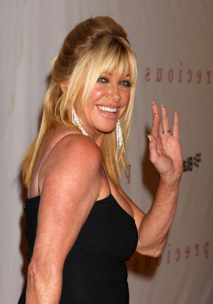 16P Suzanne Somers showing her nice big boobs and in short dress